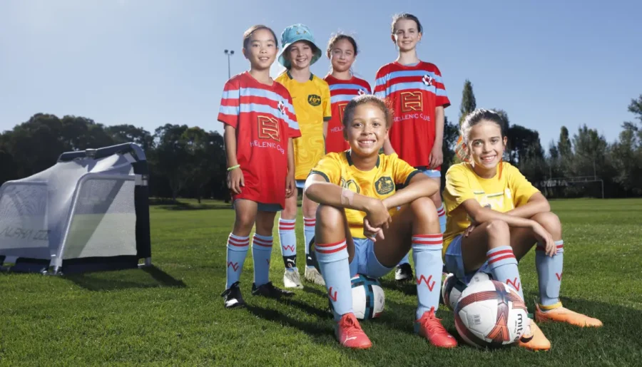 Six Woden Valley juniors girls soccer players in their uniforms.